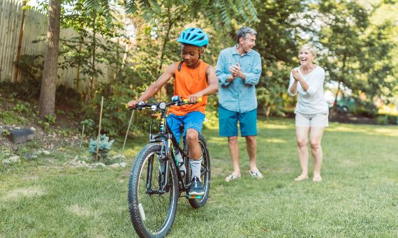 kid with helmet on a bike