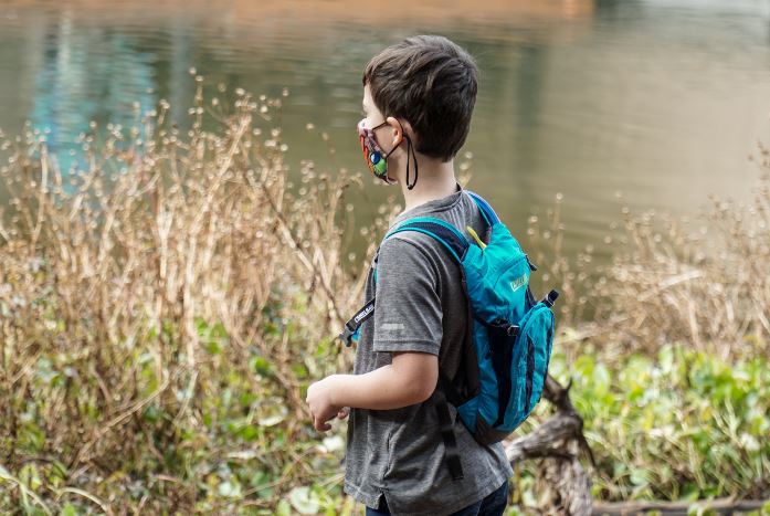 kid hiking with a backpack
