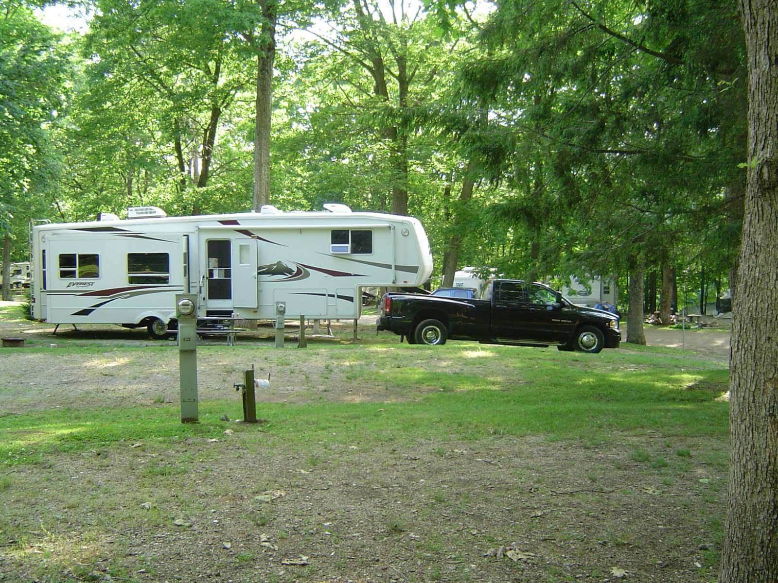 Odetah Camping Resort with a parked rv and truck