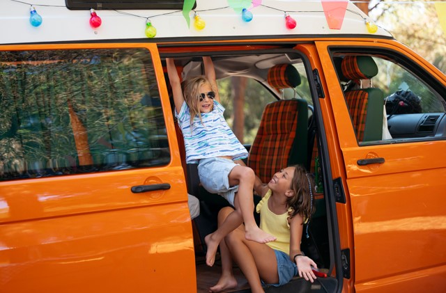 two kids enjoying vanlife