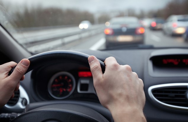 man driving a car