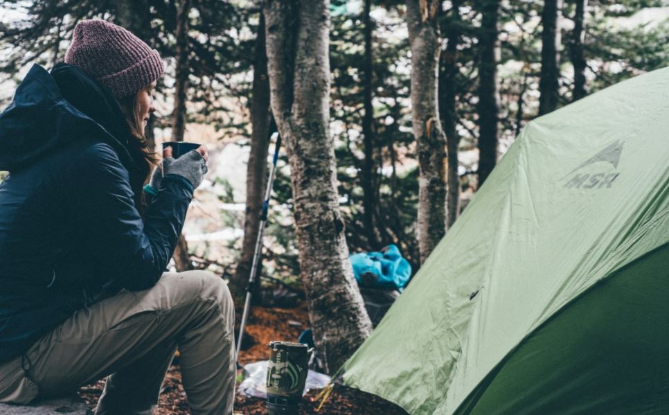 lady with cup dry camping