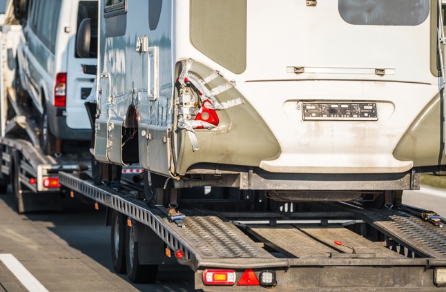 broken down rv on tow truck