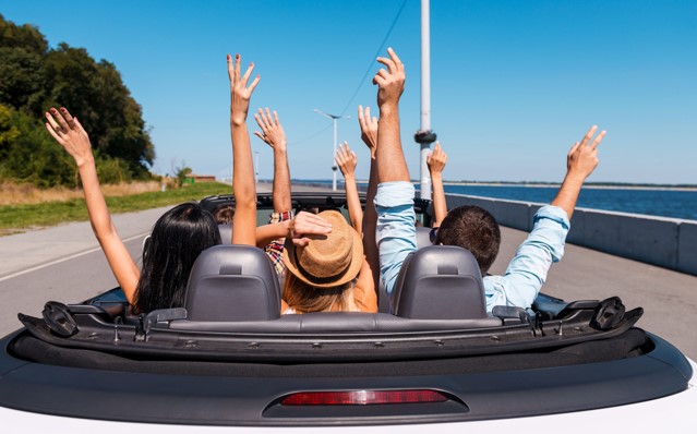 people in a car on a road trip